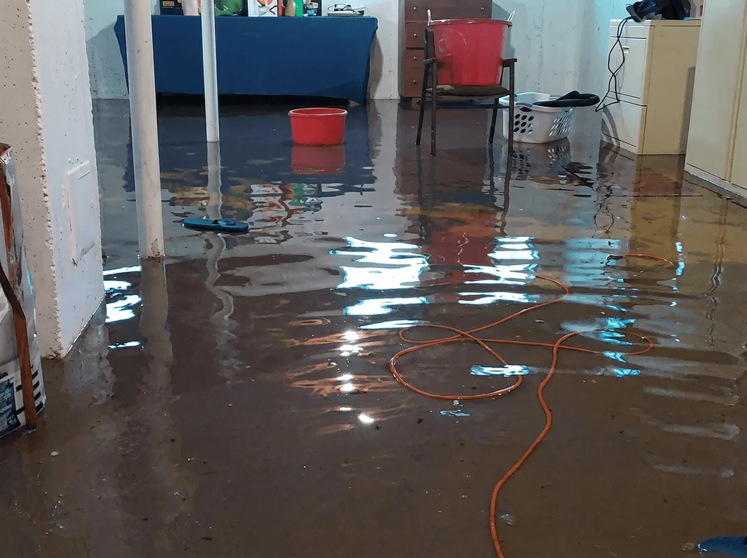 Basement with boiler, cabinets and washing machine completely flooded in Denver, CO